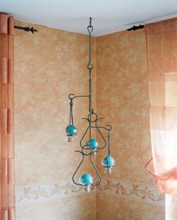 The second photo by Timo Matthies. You can see a hanging candleholder.