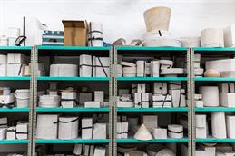 A full shelf in the workshop can be seen.